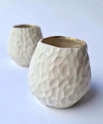 white porcelain and gold cup