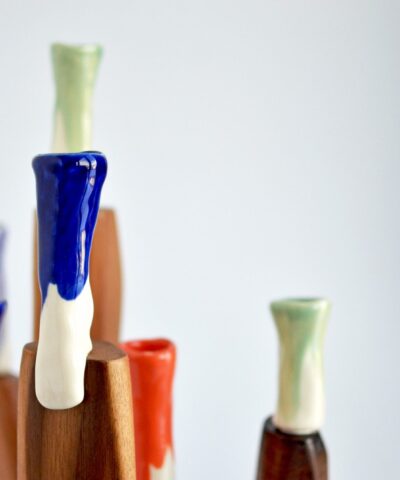 walnut wood and colorful porcelain candelabra