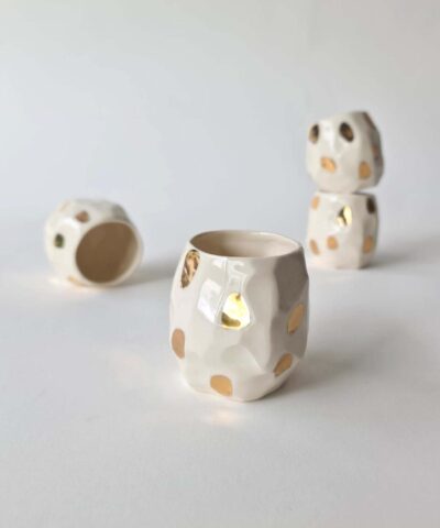 4 white cups with gold dots