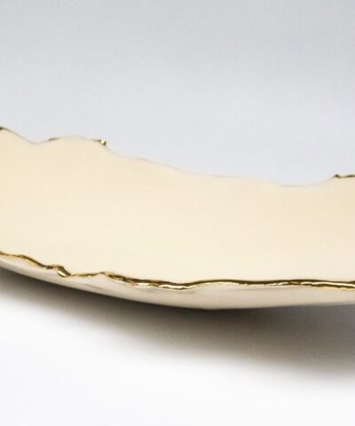 an opulent extended porcelain bowl with gilded accents