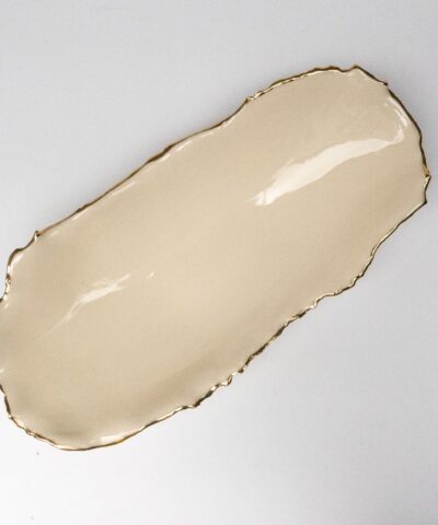An opulent extended porcelain bowl with gilded accents.