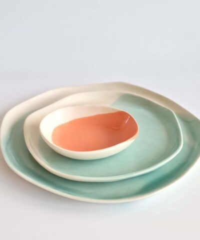 plates and a small bowl in turquoise and salmon
